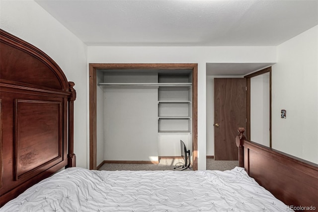 bedroom featuring light carpet and a closet