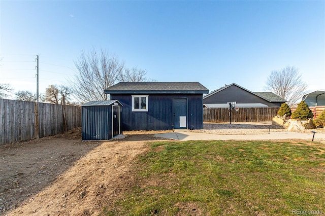 view of outbuilding featuring a lawn