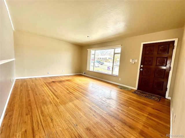 unfurnished room featuring light hardwood / wood-style floors