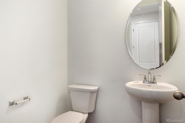 8339 Snake River St, Littleton, CO 80125 - half bathroom with toilet and a sink