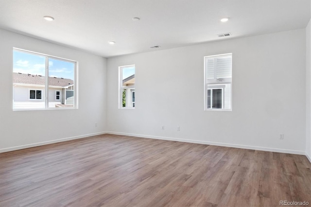 8339 Snake River St, Littleton, CO 80125 - unfurnished room featuring light wood-type flooring and recessed lighting