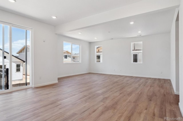 8339 Snake River St, Littleton, CO 80125 - spare room featuring healthy amount of natural light, light wood finished floors, and recessed lighting