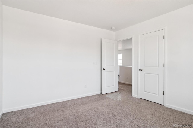 8339 Snake River St, Littleton, CO 80125 - unfurnished bedroom featuring light colored carpet and baseboards