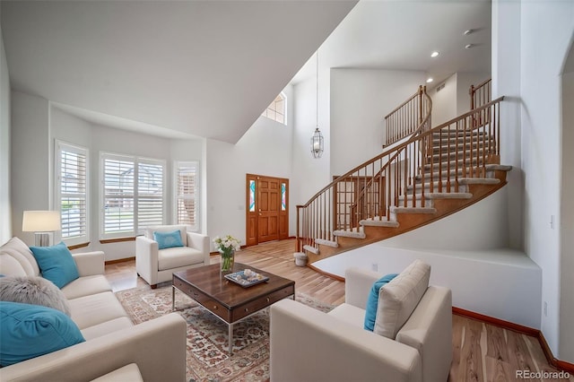 5416 S Hannibal Ct, Centennial, CO 80015 - living area with stairs, wood finished floors, and a towering ceiling