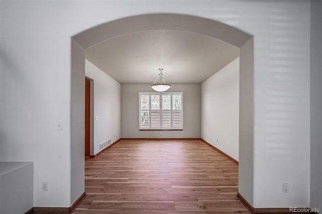 5416 S Hannibal Ct, Centennial, CO 80015 - empty room with wood finished floors and arched walkways