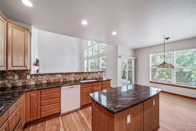 5416 S Hannibal Ct, Centennial, CO 80015 - kitchen featuring white dishwasher, tasteful backsplash, light wood finished floors, a center island, and recessed lighting