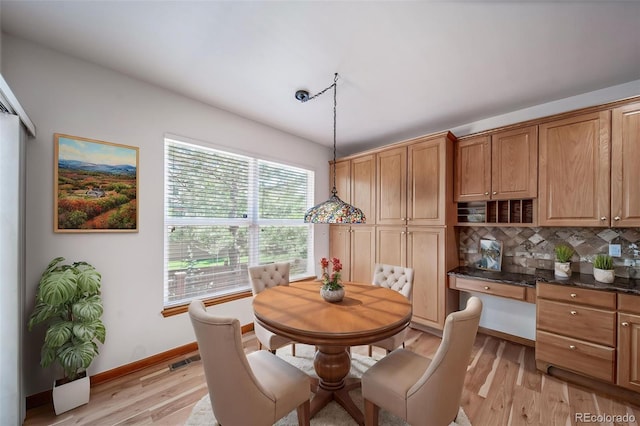 5416 S Hannibal Ct, Centennial, CO 80015 - dining room with light wood-style flooring and baseboards