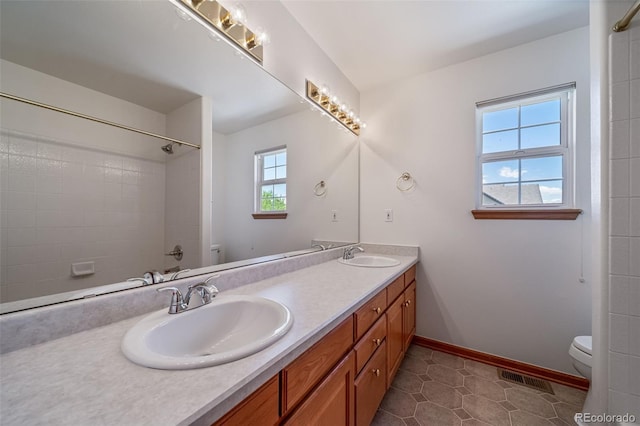5416 S Hannibal Ct, Centennial, CO 80015 - bathroom featuring double vanity and a shower