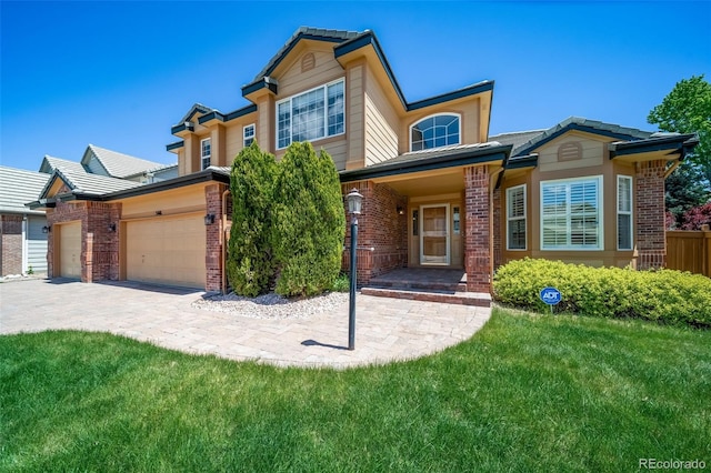 5416 S Hannibal Ct, Centennial, CO 80015 - view of front facade with brick siding, a garage, and a front yard