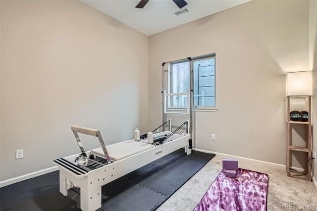 exercise area with carpet floors, visible vents, ceiling fan, and baseboards