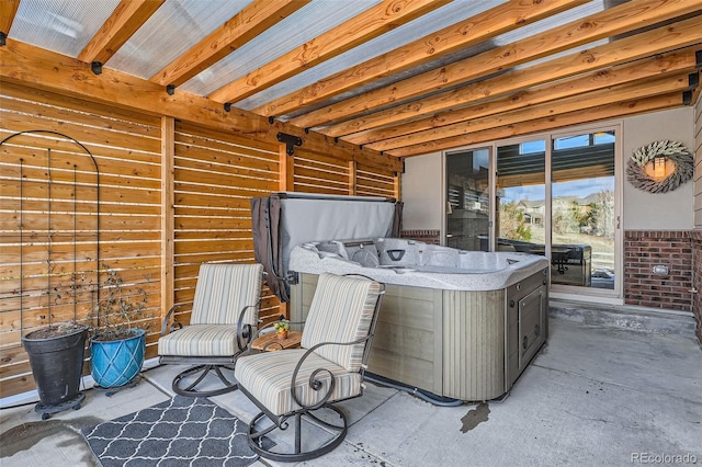 view of patio / terrace with a hot tub