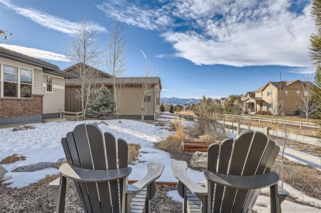 snow covered patio with fence