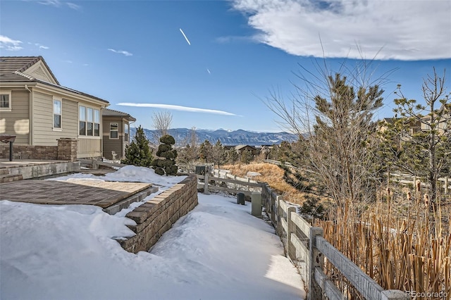 exterior space with fence and a mountain view