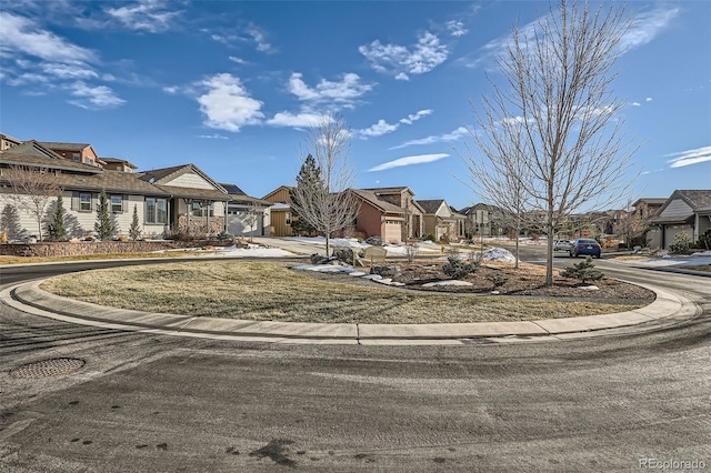 view of street with a residential view and curbs