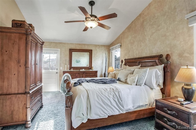 bedroom featuring ceiling fan, lofted ceiling, and dark colored carpet