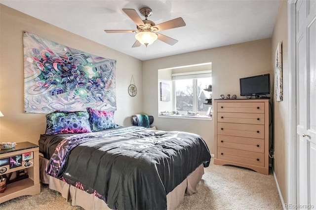 carpeted bedroom featuring ceiling fan