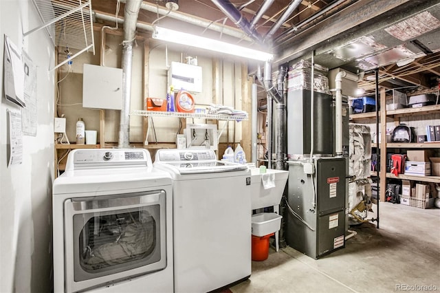 clothes washing area with washing machine and clothes dryer