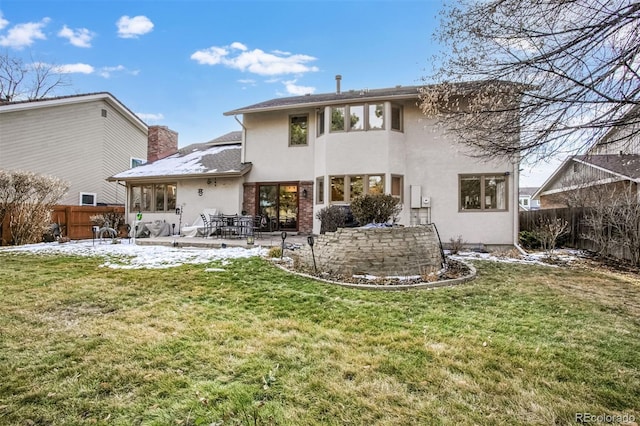 back of house featuring a yard and a patio area