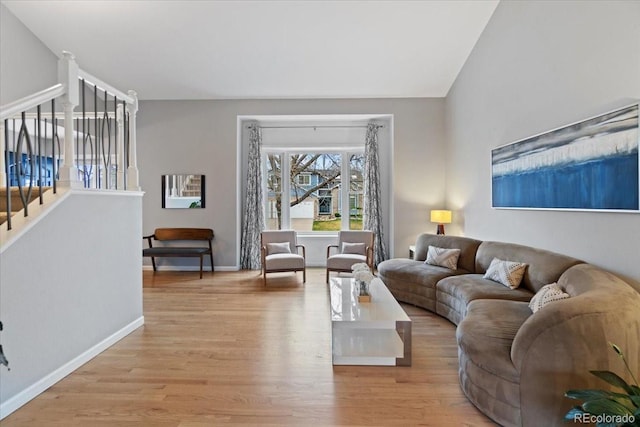 5310 S Flanders Way, Centennial, CO 80015 - living room featuring baseboards, light wood finished floors, and stairs