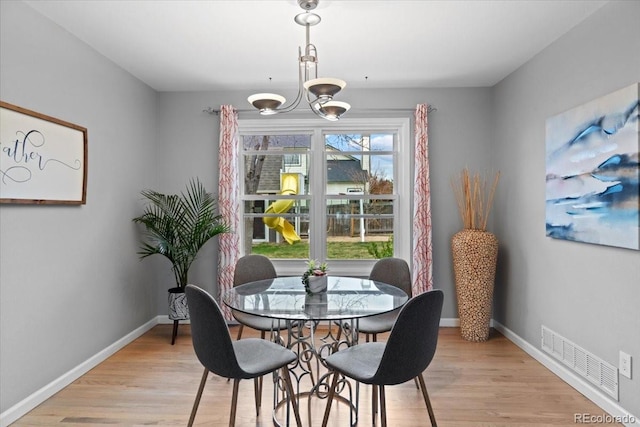 5310 S Flanders Way, Centennial, CO 80015 - dining room with baseboards, a notable chandelier, light wood-style flooring, and visible vents