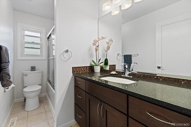 5310 S Flanders Way, Centennial, CO 80015 - full bathroom with vanity, toilet, tile patterned floors, baseboards, and visible vents
