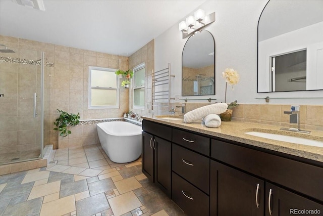 5310 S Flanders Way, Centennial, CO 80015 - bathroom with double vanity, a shower stall, and a sink