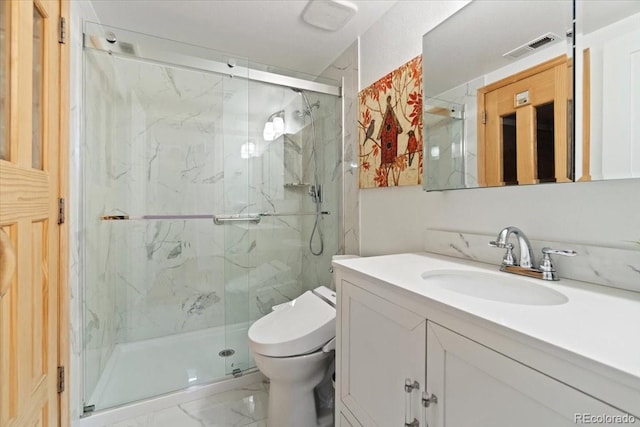 5310 S Flanders Way, Centennial, CO 80015 - bathroom with visible vents, marble finish floor, a marble finish shower, and toilet