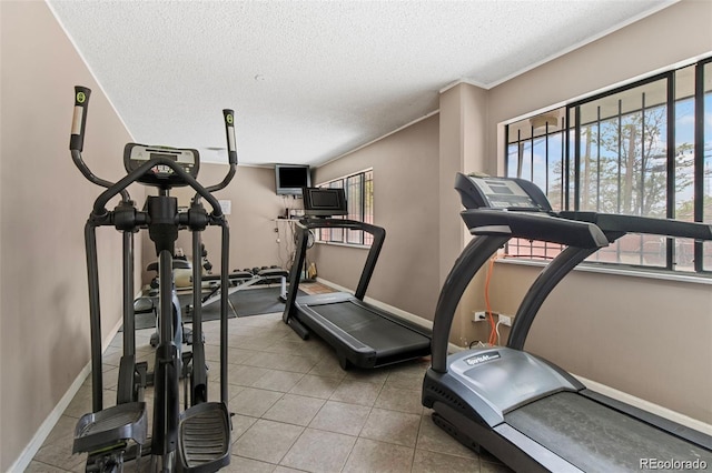 workout room with a textured ceiling