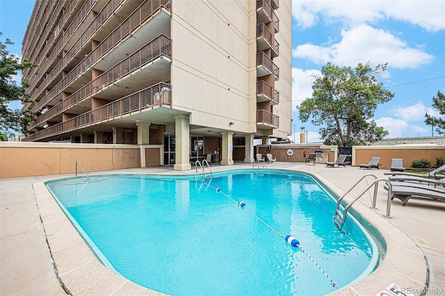 2225 Buchtel Blvd Unit 208, Denver, CO 80210 - community pool with a patio area