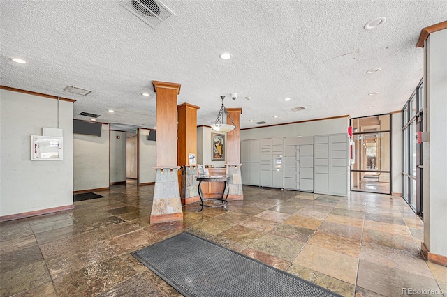 2225 Buchtel Blvd Unit 208, Denver, CO 80210 - community lobby with a textured ceiling and recessed lighting
