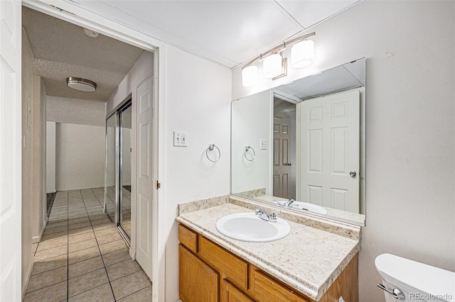 2225 Buchtel Blvd Unit 208, Denver, CO 80210 - bathroom with vanity and tile patterned floors
