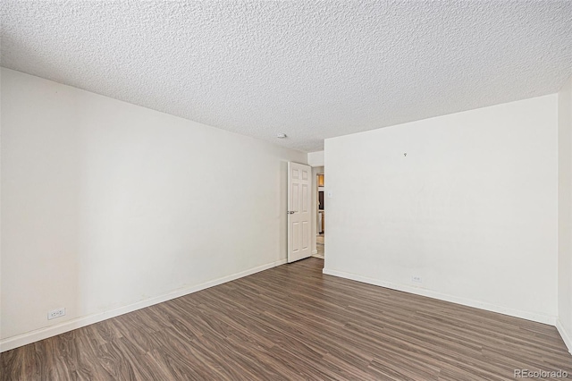 2225 Buchtel Blvd Unit 208, Denver, CO 80210 - empty room featuring dark wood-type flooring and a textured ceiling