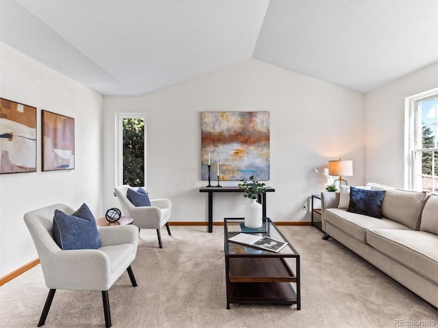 living room featuring lofted ceiling and light colored carpet