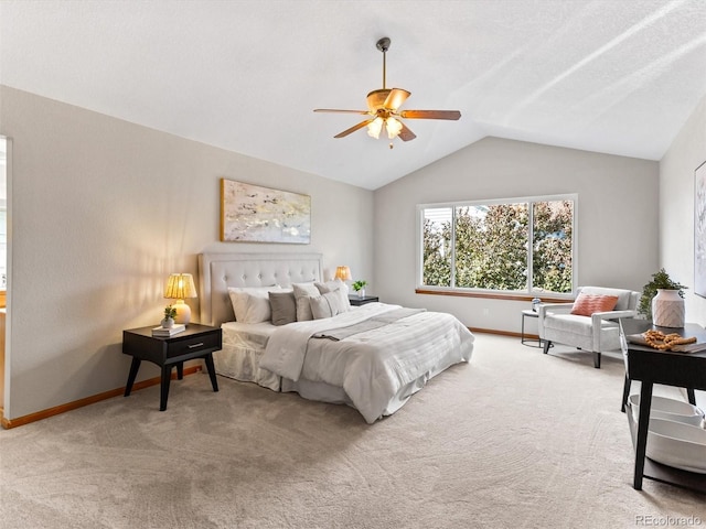 bedroom featuring baseboards, ceiling fan, carpet flooring, and vaulted ceiling