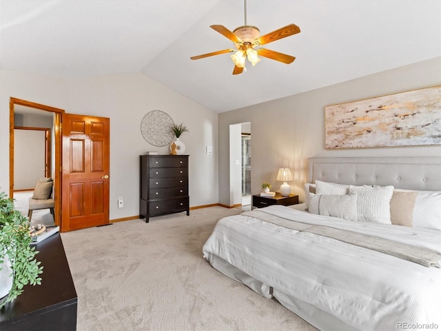 carpeted bedroom featuring vaulted ceiling, a ceiling fan, and baseboards