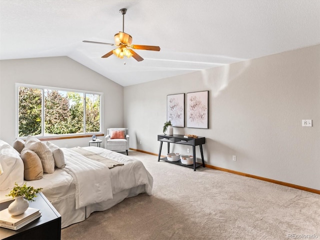 carpeted bedroom featuring baseboards, lofted ceiling, and ceiling fan