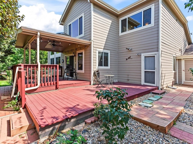 wooden terrace with a ceiling fan