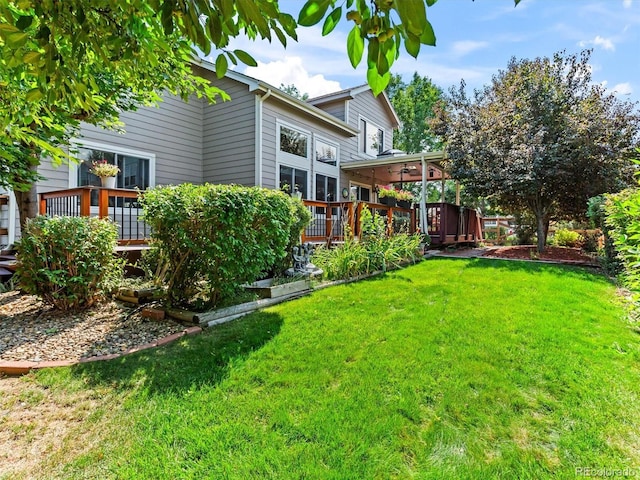 view of yard with a wooden deck