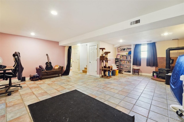 exercise room with light tile patterned floors