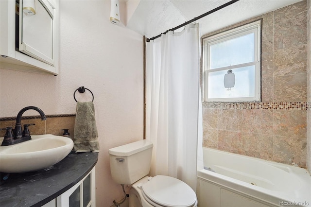 full bathroom with vanity, toilet, and shower / tub combo with curtain