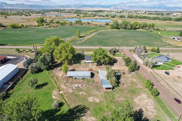 bird's eye view with a water and mountain view and a rural view