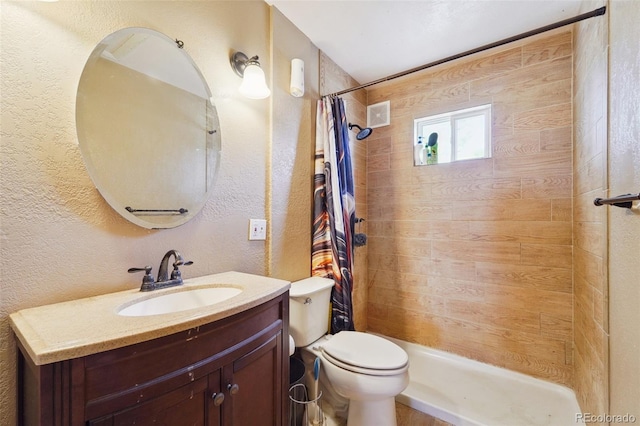 bathroom featuring toilet, vanity, and a shower with shower curtain