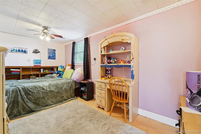 bedroom with ceiling fan, light wood-type flooring, and crown molding