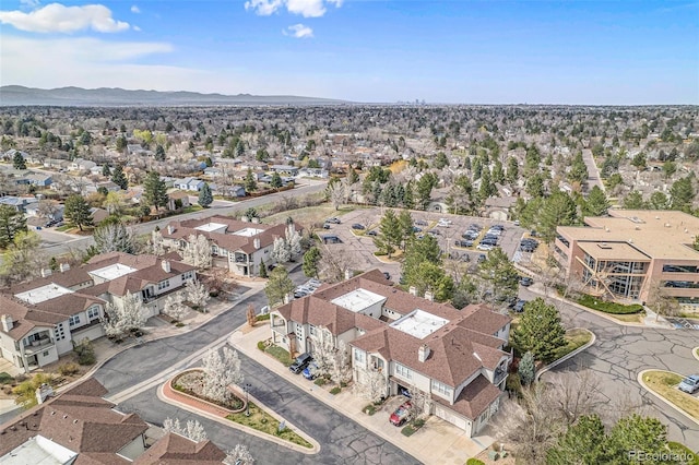 drone / aerial view featuring a residential view and a mountain view