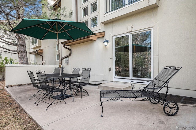 view of patio featuring outdoor dining area