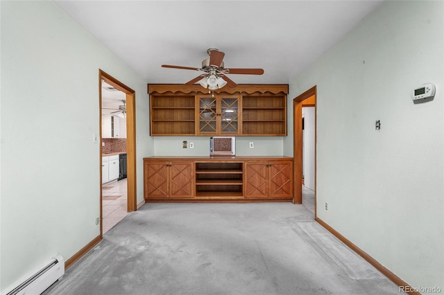 1280 Xanadu St, Aurora, CO 80011 - bar with a baseboard radiator, ceiling fan, light carpet, and black dishwasher