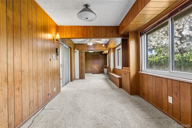 1280 Xanadu St, Aurora, CO 80011 - hall with carpet and wooden walls