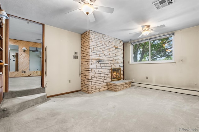 1280 Xanadu St, Aurora, CO 80011 - unfurnished living room featuring a ceiling fan, carpet flooring, a stone fireplace, and wood walls
