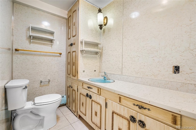 1280 Xanadu St, Aurora, CO 80011 - bathroom featuring vanity, tile patterned floors, and baseboard heating
