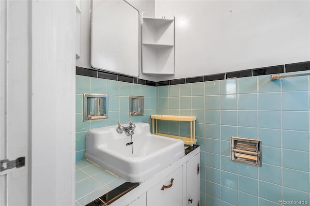 1280 Xanadu St, Aurora, CO 80011 - bathroom featuring tile walls and vanity